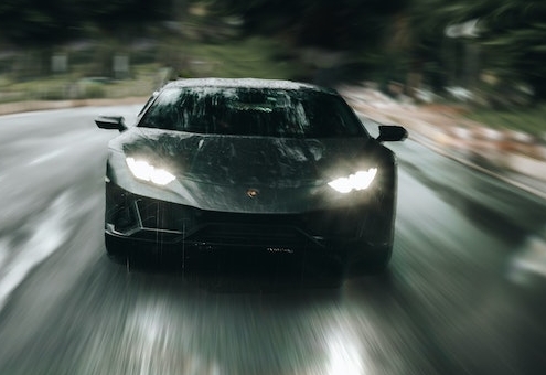 Blog header image of a fast car racing along a road for the blog on the Faster, Easier Way to Manage KPIs in 2021 with Reporting Software blog from Solver, a developer of Corporate Performance Management / Budgeting and Reporting software